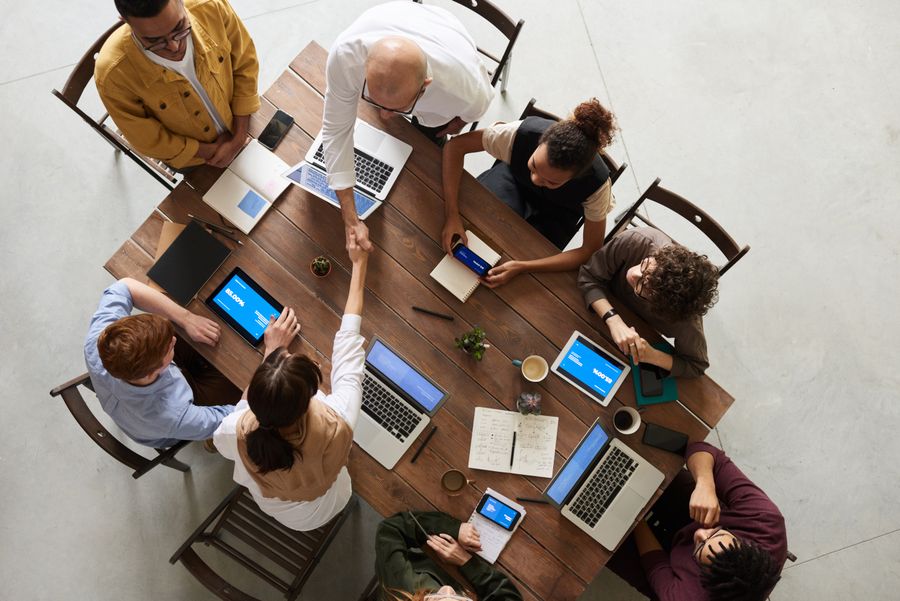 A small business team reviewing figures together at a table.